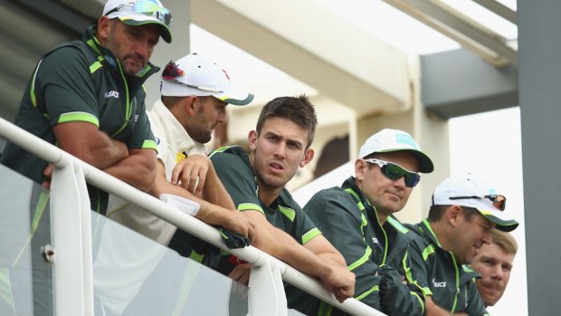 Time to regroup: Nathan Lyon and Mitch Marsh of Australia look on after their devastating loss to England.