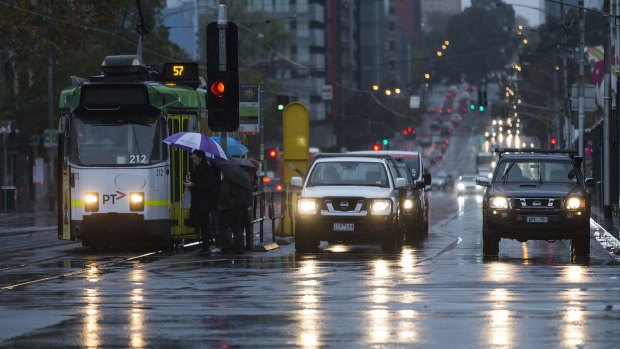 Melbourne commuters braved a wet and cold morning in the CBD on Monday.
