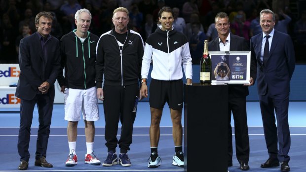 Mats Wilander, John McEnroe, Boris Becker, Rafael Nadal and Chris Kermode present Lleyton Hewitt (second right) with the ATP Roll of Honour at the ATP World Tour Finals on Wednesday.