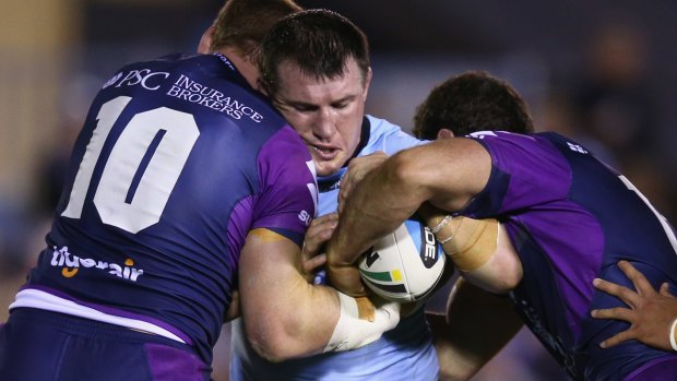 On the charge: Paul Gallen takes on the Melbourne defence.