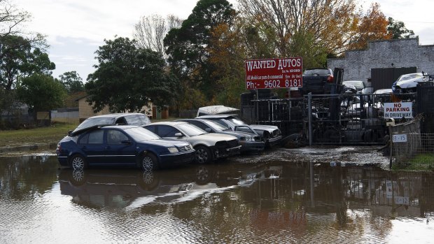 Cars trapped in floodwaters on Newbridge Road, Milperra.