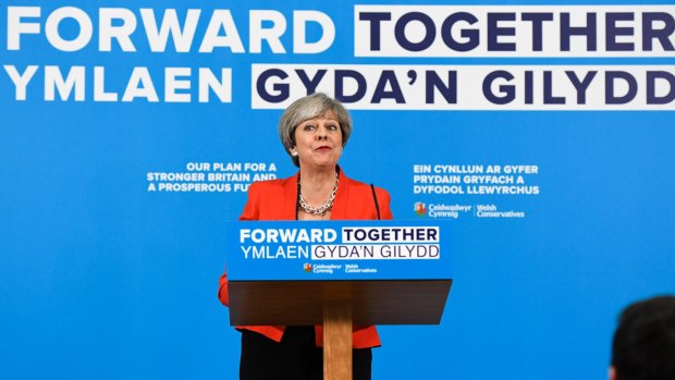Theresa May has been forced to backtrack on one of her most striking election pledges.