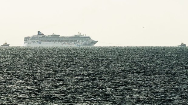 The Norwegian Star being towed back to Melbourne as seen from Mornington Pier on Saturday afternoon.