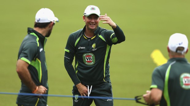 Fun and games: Michael Clarke has a laugh with teammates at training.