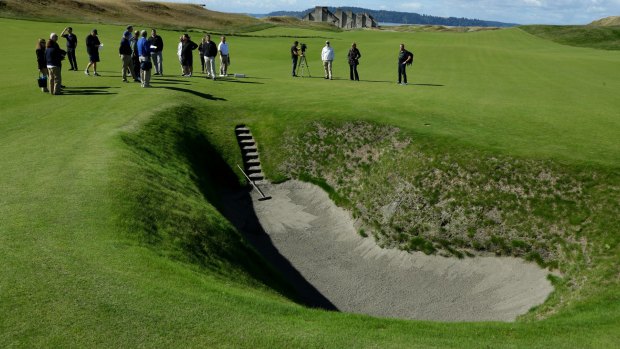 Bunker madness: The deep pot bunker on the 18th fairway at Chambers Bay.