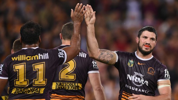 Rejoicing: Matt Gillett celebrates with teammates after the Broncos beat the Roosters 24-14.