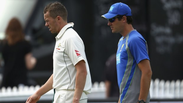 Under a cloud: Peter Siddle with Australian team physiotherapist David Beakley.