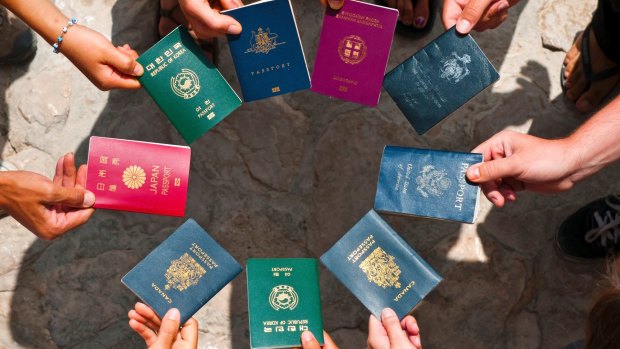 Why is every passport in the world said to feature a varying shade of either red, green, black or blue?