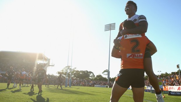 Sunny days:  David Nofoaluma and Kevin Naiqama celebrate a Tigers try.