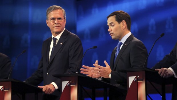 Marco Rubio speaks as Jeb Bush, left, listens during a debate of Republican presidential hopefuls at the University of Colorado in Boulder in October.