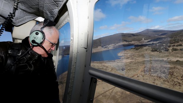 The Prime Minister during his aerial tour of the region via helicopter.