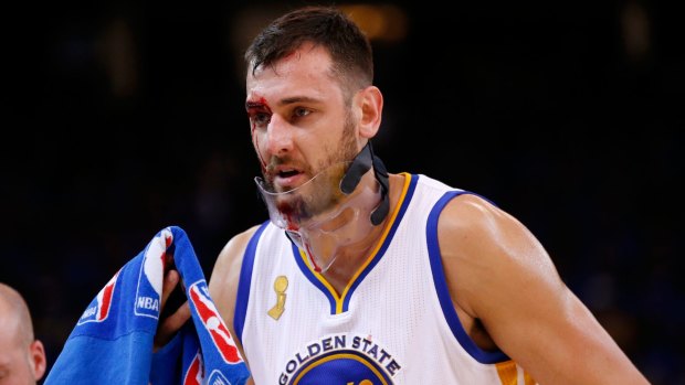 Walking wounded: Andrew Bogut leaves the court against New Orleans last year.