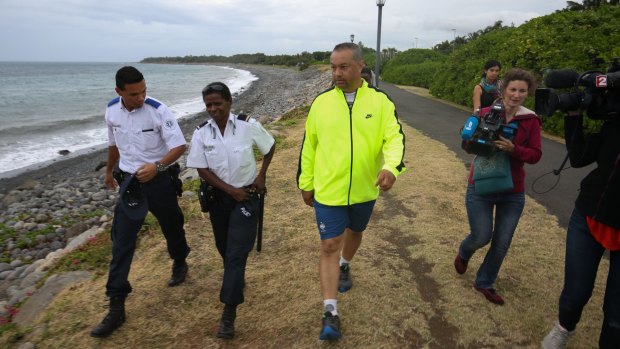 Bruno, wearing a yellow top, says he found the plastic object while jogging along a St Denis beach.