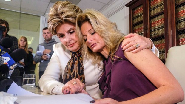 Attorney Gloria Allred, left, comforts Summer Zervos during their press conference. 