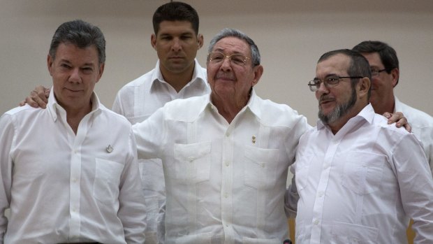Cuban President Raul Castro, centre, with Colombian President Juan Manuel Santos, left, and FARC commander Timoleon Jimenez in Havana.