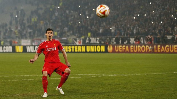 Going, going ... gone: Dejan Lovren misses his penalty as Liverpool lose the shootout.