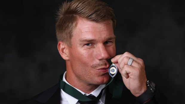 Sealed with a kiss:  David Warner poses after winning the Allan Border medal.