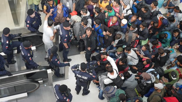 Crowds build at Salzburg's train station on Tuesday.