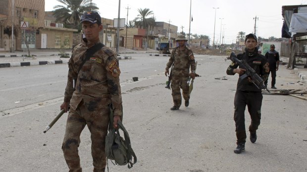 Iraq's elite counterterrorism forces enter downtown Hit on April 7.