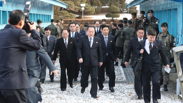 North Korean Ri Son-gwon, centre, arrives at the South side for the meeting with South Korea at the Panmunjom in the Demilitarized Zone in Paju.