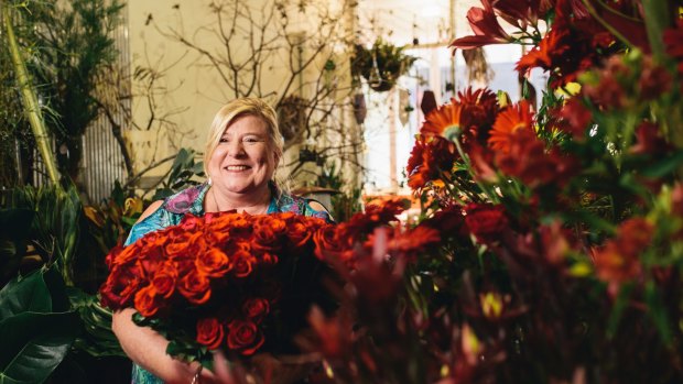 Manuka Flowers owner Sue Burden with some of the many roses she will sell for Valentine's Day.
