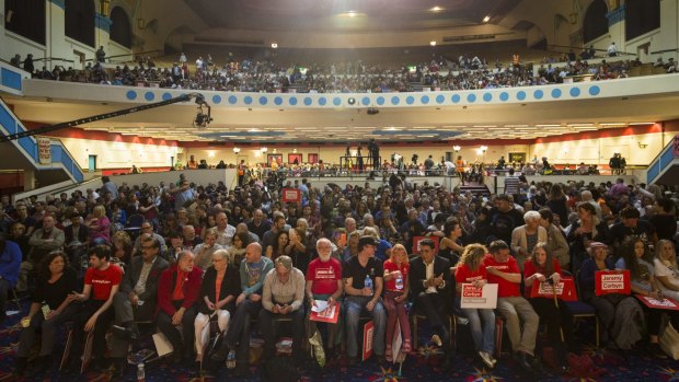 Thousands of Jeremy Corbyn supporters sit in the audience during a rally for the Labour leader at Ruach City Church in Kilburn