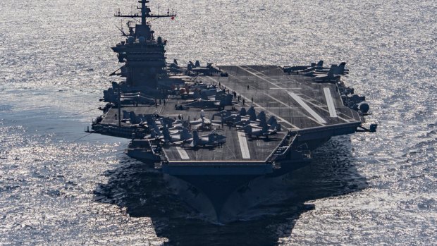 Aircraft carrier USS Harry S Truman navigates the Gulf of Oman on Christmas Day. 