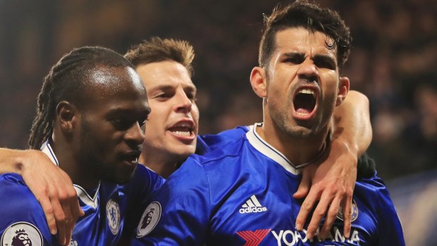 Chelsea star Diego Costa celebrates scoring a goal with team mates.