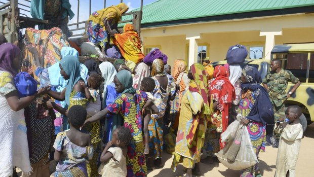 Women and children rescued by Nigerian soldiers from Boko Haram extremists in the north-east of Nigeria arrive at the military office in Maiduguri.