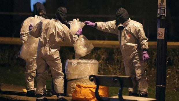 Investigators in protective suits in Salisbury, England, on March 13.