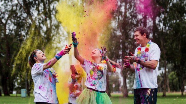 Jacqueline and Stephen Larkham with their children Tiahna 10, and Jaimee 13 preparing for the Canberra Color Run.