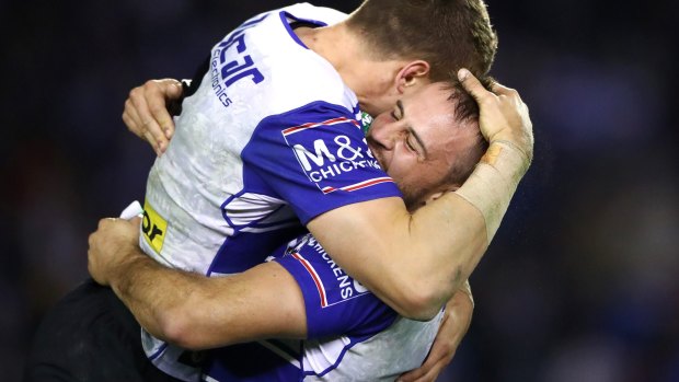 Let off: Josh Reynolds of the Bulldogs celebrates a conversion kicked by team mate Kerrod Holland after giving away a last-second penalty.