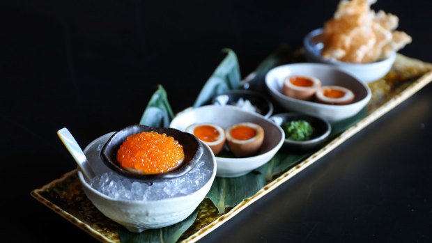Chuuka's roe service with house-marinated trout roe, cashew cream, shallots, chives, tea eggs and potato rice crackers.