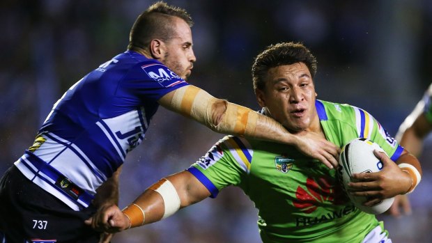 Josh Papalii charges at Josh Reynolds during Canberra's 22-8 win over Canterbury on Monday. 