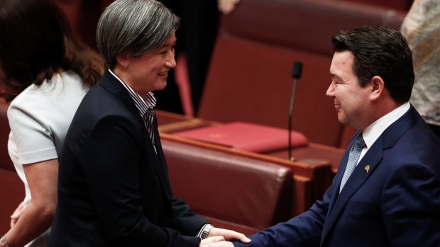 Labor's Penny Wong congratulates Smith after his speech. 