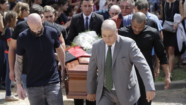 Lost: Emiliano Sala's coffin is carried by teammates, family and friends at his funeral in Argentina.