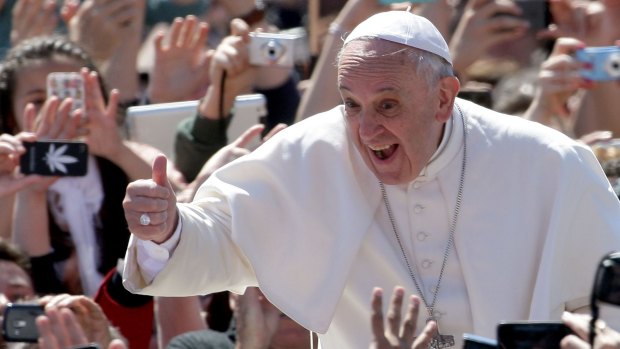 Greeting the faithful: But Pope Francis' views aren't getting the thumbs up from US Republicans.