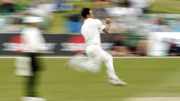 Steaming in: Mitchell Johnson bowling during the match against Kent.