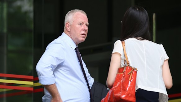 An official from the Australian Consulate in Guangzhou outside court for Anthony Bannister's sentencing.