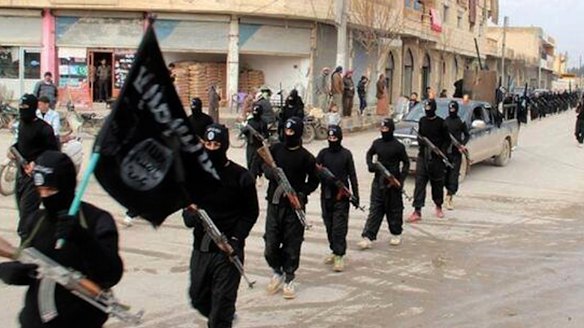 Fighters from the al-Qaeda linked Islamic State marching in Raqqa, Syria, in January last year. 
