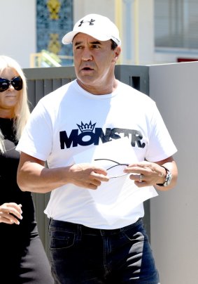 Jeff Fenech reads a statement outside his Five Dock home on Wednesday.
