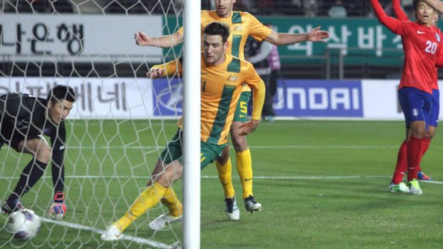 Heading home: Socceroo Robert Cornthwaite celebrates a goal against South Korea in 2012.