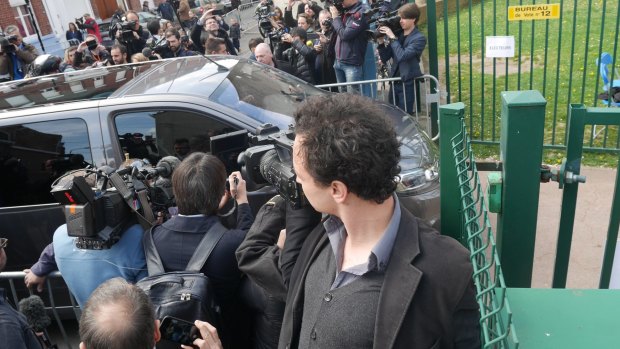 The Le Pen convoy arrives to vote.