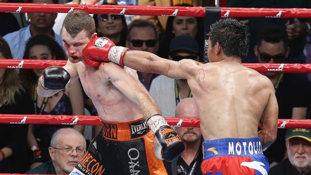 On the ropes: Jeff Horn wore several vicious shots from Manny Pacquiao throughout the ninth round. 
