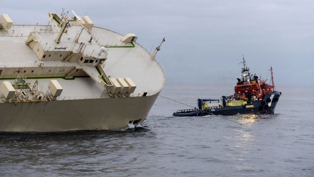The cargo ship Modern Express is towed as it drifts off the coast of France.