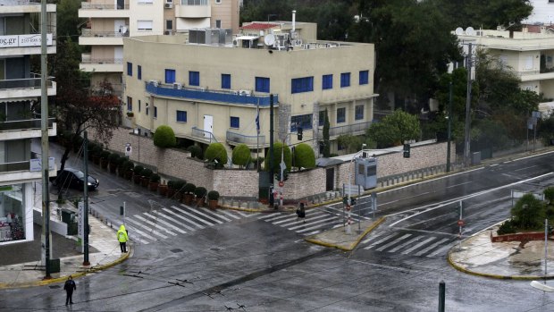 Police guard the Israeli Embassy after a pre-dawn attack in Athens on Friday.