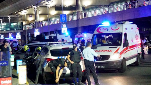 Turkish security officers and ambulances gather outside Istanbul Ataturk Airport.