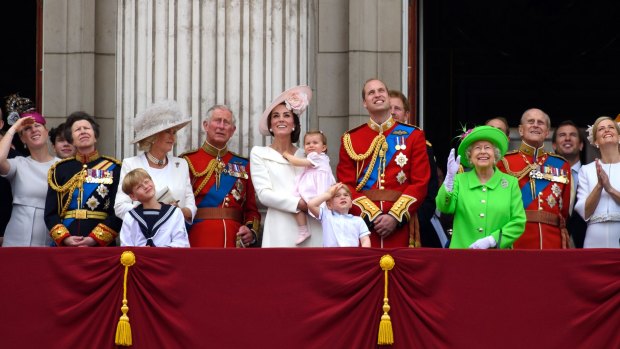 Queen Elizabeth II (in green) is surrounded by family during her 90th birthday celebrations.  