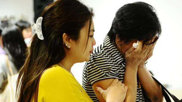 Grief: Relatives of missing AirAsia passengers.