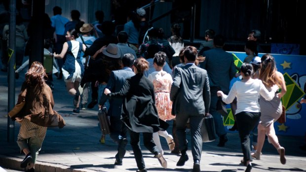 Run, run, run as extras run from fictitious monsters in inner-city Brisbane is transformed into'Tokyo' for Pacific Rim - Maelstrom. 
